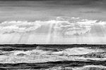 Sun rays peaking through the clouds on the Oregon coast.  Seal Rocks, OR.