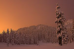 Sunset in the Cascade Mountains after a storm left a blanket of fresh snow.
